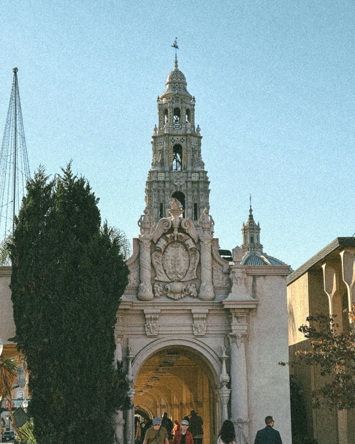 Ornate Balboa Park architecture framed by trees